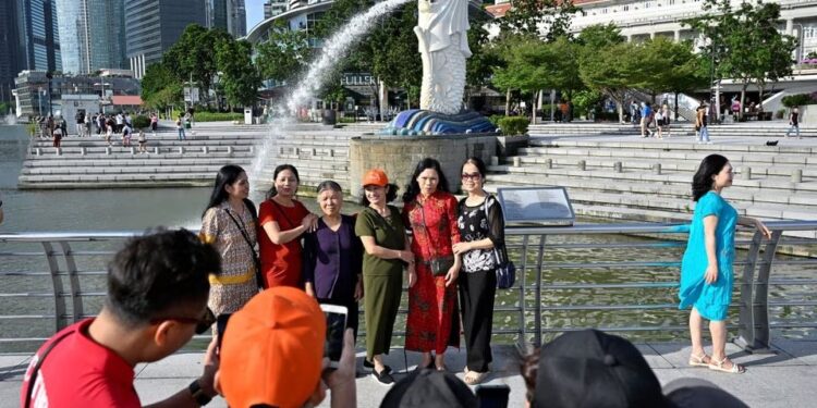 After opening borders, China presses Singapore for visa-free travel deal