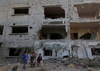 Gazans amid the rubble of homes flattened by fighting