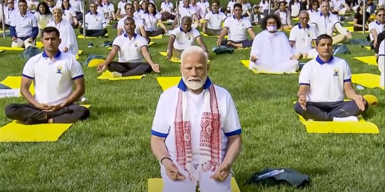 Protestors accuse Modi of using yoga to whitewash India’s crimes, as he leads yoga demo at UN