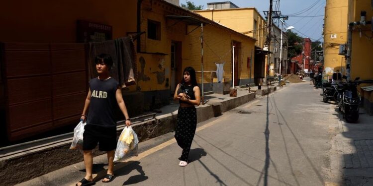 Chinese cities brace for floods as heat scorches inland regions