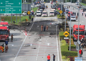 Ten killed in light plane crash on street in Malaysia