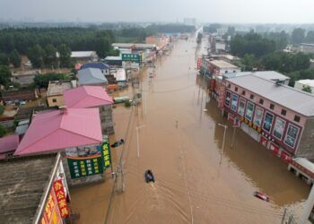 Streets become rivers as Beijing records heaviest rain in 140 years