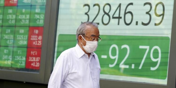 Japan stocks soar as yen hits 1-year low