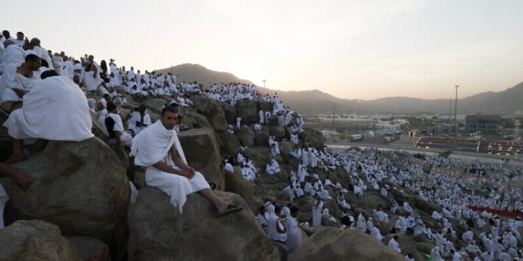 ‘Very blessed’: Muslim pilgrims pray at Mount Arafat in Haj apex