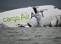 Cargo plane skids off Hong Kong runway, kills 2