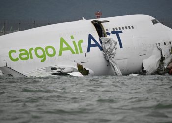 Cargo plane skids off Hong Kong runway, kills 2