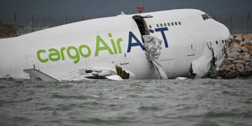 Cargo plane skids off Hong Kong runway, kills 2