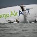 Cargo plane skids off Hong Kong runway, kills 2