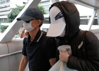 Hong Kong sentences father of wanted activist to 8 months in jail